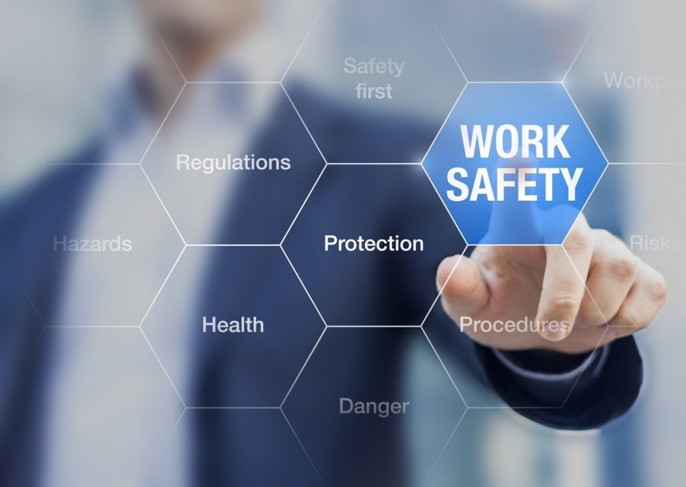 Abstract of man pressing Work Safety button