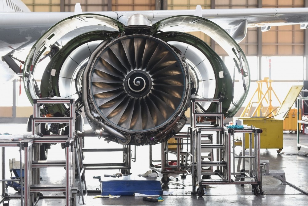 etq reliance aviation safety management airplane engine being built in hanger
