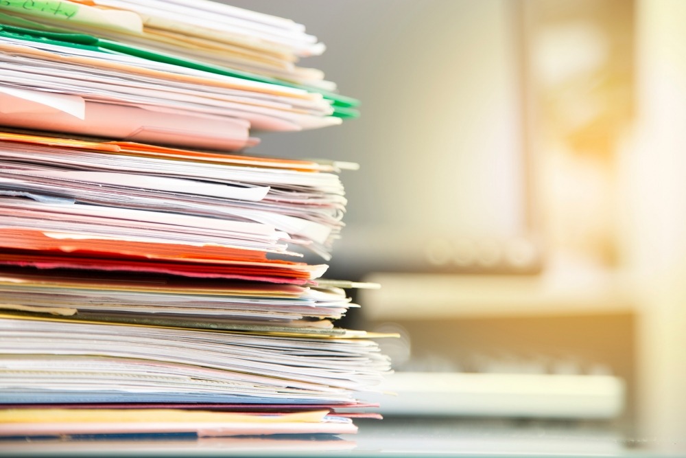 Stack of folders containing documents